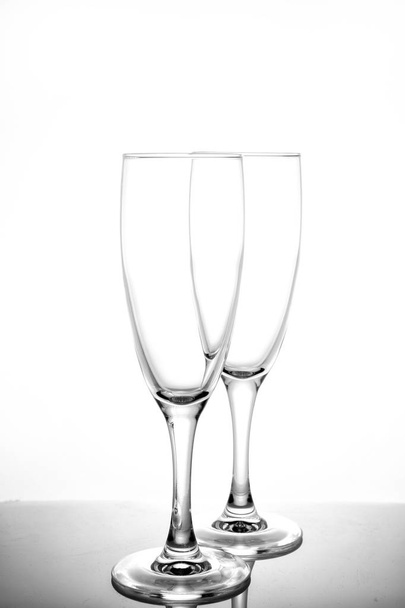 empty glasses for wine and champagne on a white background verti - Fotó, kép