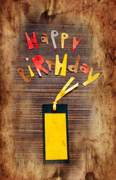 Vintage postcard on wooden background with Words happy birthday - Foto, Imagen
