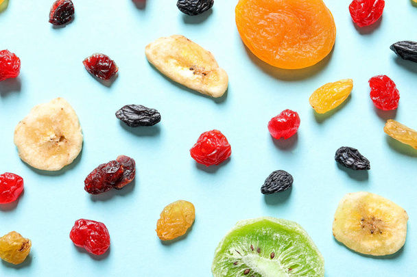 Flat lay composition with different dried fruits on color background. Healthy lifestyle - Photo, Image