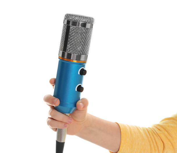 Child holding microphone on white background, closeup - 写真・画像