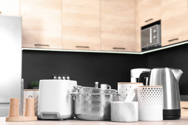 Set with modern domestic appliances in kitchen - Photo, Image