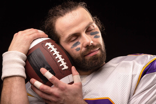 Close up portrait of American Football Player with ball - Photo, image