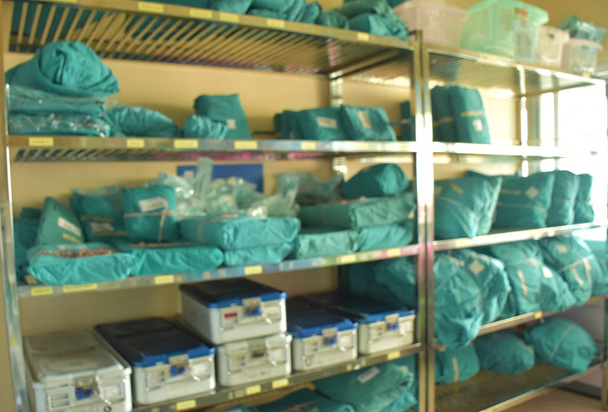 Blurred shelves that there are sterile sets  in clean room of operating floor. - Photo, Image