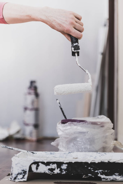 White paint with roller brush - Photo, image