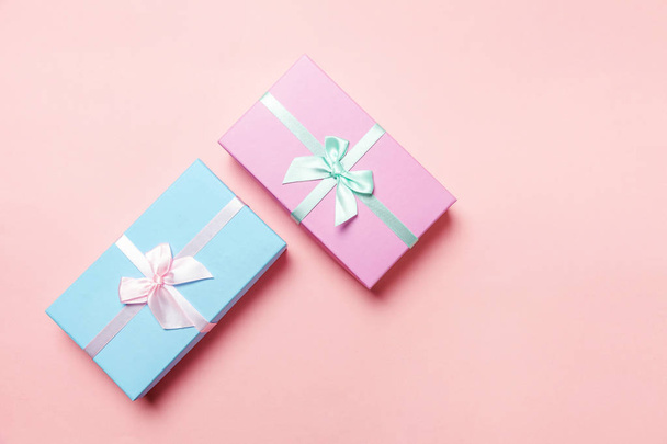 Christmas New Year birthday valentine celebration present romantic concept. Pink blue gift box isolated on pink background - Foto, afbeelding