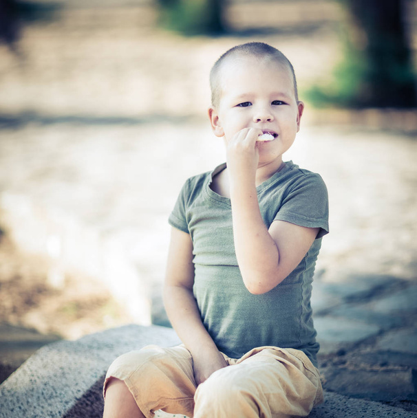 Outdoor portrait of cute little boy - Photo, Image