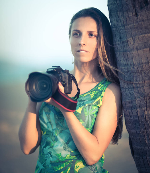 Portrait of a woman photographer with camera - Foto, immagini