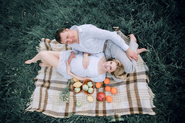 top view.happy family lying on a blanket during a picnic - Fotó, kép