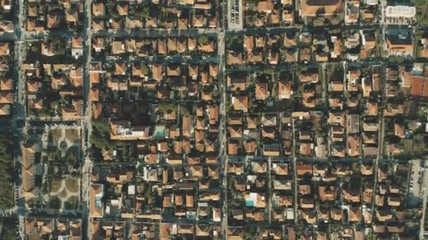 Aerial top down view of tiled roofs of luxury villas and gardens in Forte dei Marmi. Tuscany, Italy - Metraje, vídeo