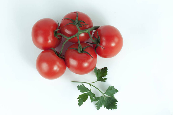 tomatoes on a branch .isolated white background - Foto, immagini
