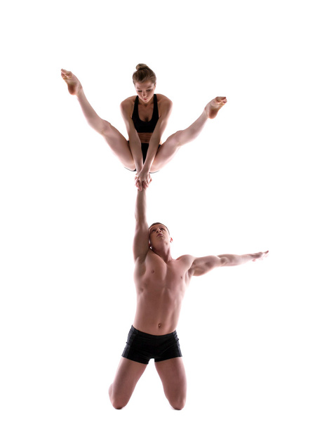 Attractive young showing acrobatic trick - Fotó, kép