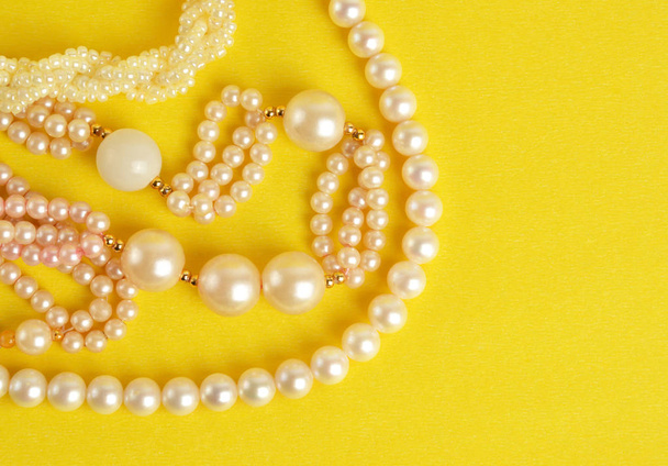 Pearl Jewelry on yellow background - Photo, Image