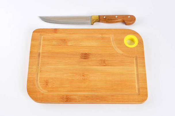 Tagliere con coltello da cucina
 - Foto, immagini