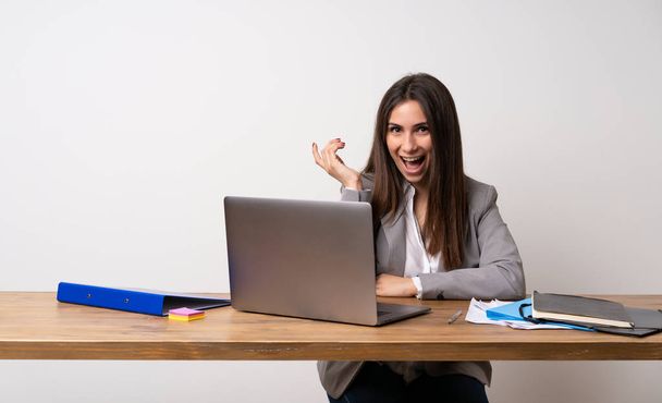 Business woman in a office smiling a lot - Photo, Image