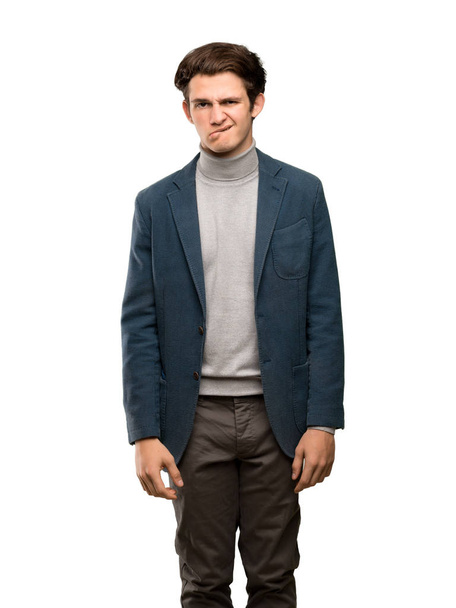Teenager man with turtleneck with confuse face expression while bites lip over isolated white background - Photo, Image