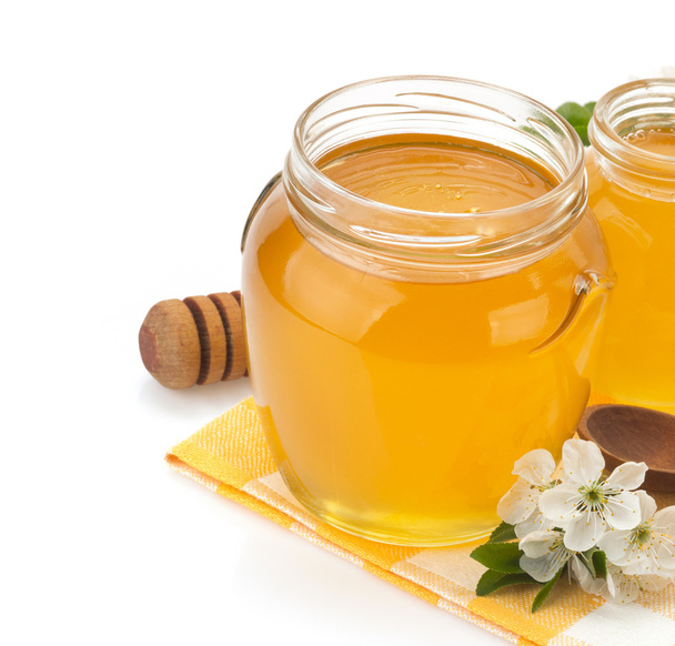 glass jar full of honey and stick - Foto, Imagem