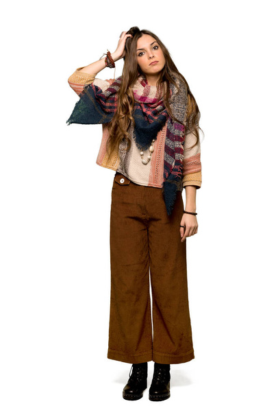 Full-length shot of Young hippie woman with an expression of frustration and not understanding on isolated white background - Photo, Image