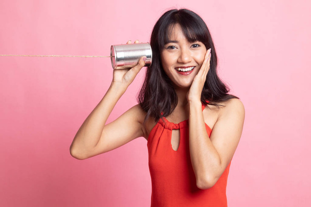 Happy Young Asian woman listen with tin can phone. - Valokuva, kuva