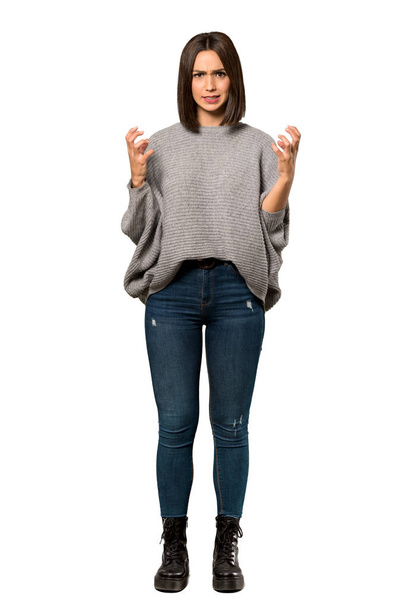 A full-length shot of a Young woman frustrated by a bad situation over isolated white background - Photo, Image
