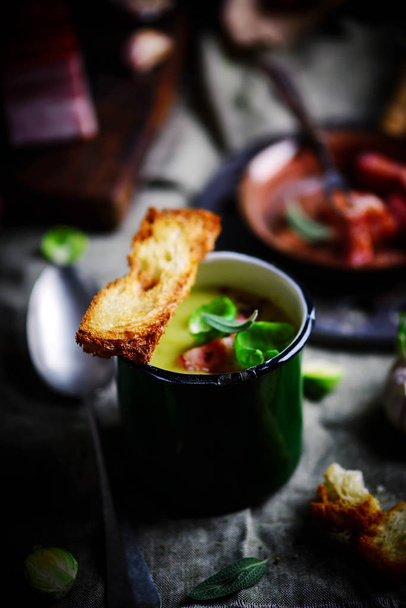 Brussels sprouts soup with bacon.dark photo - Photo, Image