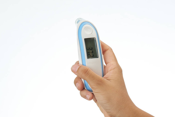Hand holding digital thermometer - Photo, Image