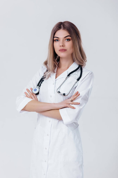doctor woman in white coat with stethoscope - Фото, изображение