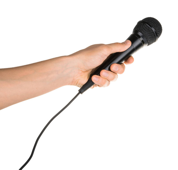 Hand holding microphone isolated on white clipping path - Photo, image