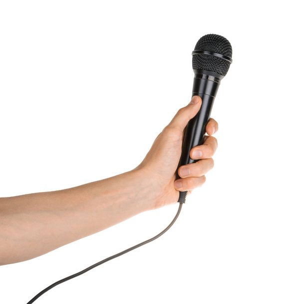 Рука тримає мікрофон ізольовано на білому відсічному контурі
 - Фото, зображення