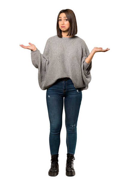 A full-length shot of a Young woman unhappy because not understand something over isolated white background - Fotografie, Obrázek