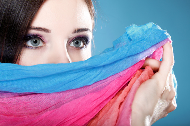 woman hides her face with shawl - Foto, imagen