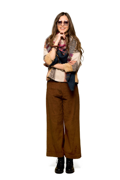 Full-length shot of Young hippie woman with glasses and smiling on isolated white background - Photo, image