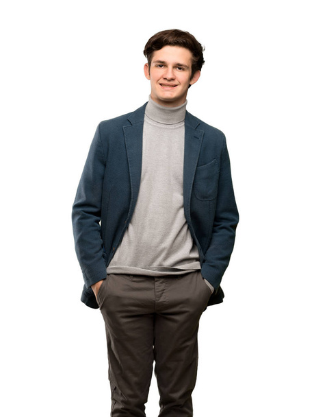 Hombre adolescente con cuello alto riendo mirando al frente sobre un fondo blanco aislado
 - Foto, Imagen