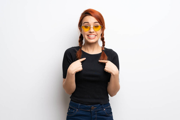 Young redhead woman over white wall with surprise facial expression - Foto, immagini