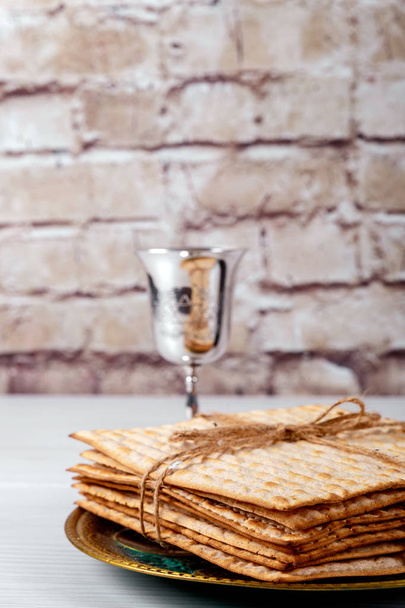 Pesach Passover symbols of great Jewish holiday. Traditional matzoh, matzah or matzo - Photo, Image