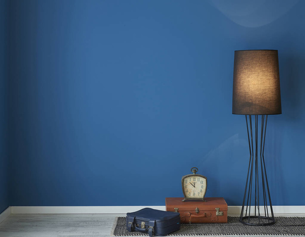 Blue wall lamp, frame, poster, chair concept. - Photo, Image