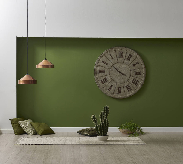 Πράσινο φωτιστικό τοίχου μαξιλάρι καρέκλα και χαλί νεκρή φύση. - Φωτογραφία, εικόνα