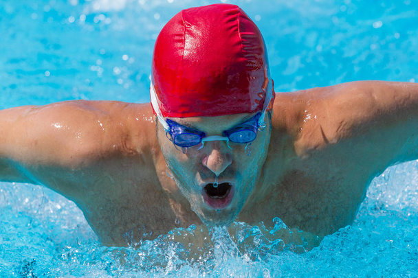 Sportsman swimming in a pool - Fotoğraf, Görsel