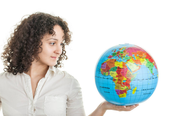 young woman with a globe - Foto, Bild