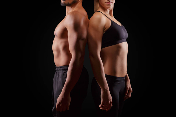 Sporty couple on dark background - Photo, Image