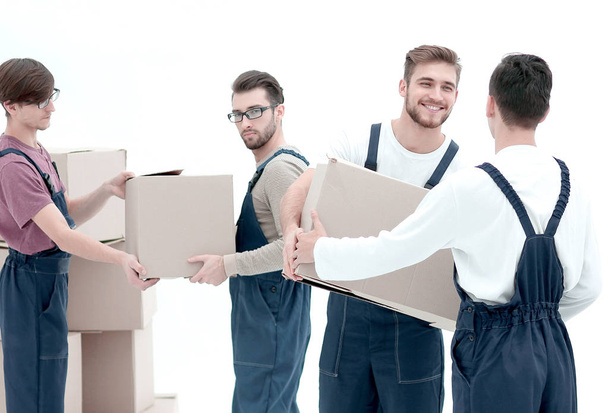 Delivery men with cardboard boxes on white background. - Photo, Image