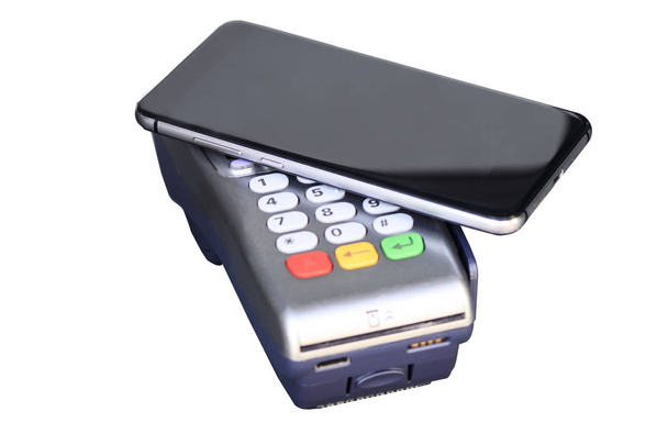 payment through the cash terminal. mobile phone as a bank card. isolate on white background. - Photo, Image