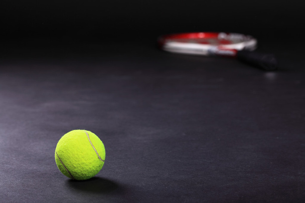 tennis racket and balls on black background - Zdjęcie, obraz
