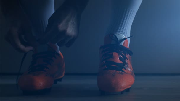 Soccer football player put on his shoes. Slow Motion.  - Imágenes, Vídeo