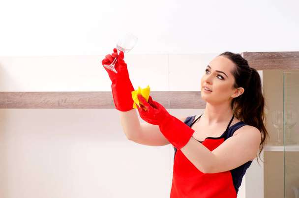 Young beautiful woman cleaning apartment  - Foto, afbeelding