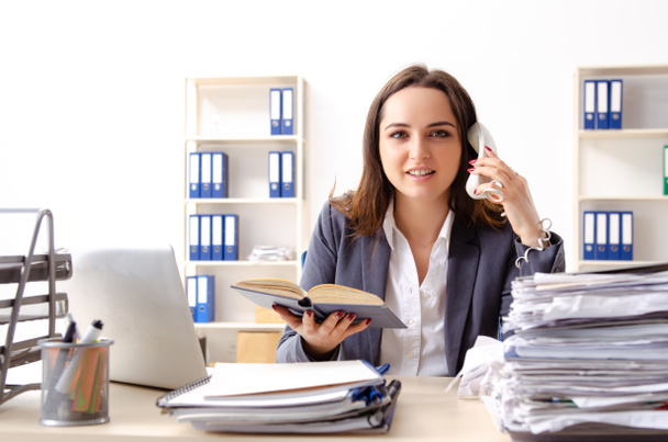 Young female employee unhappy with excessive work  - Photo, Image