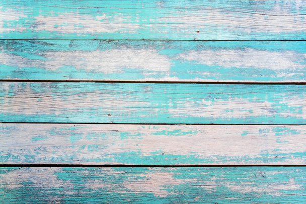 Ročník pláž dřevo pozadí - Staré ošlehaný dřevěné prkno malované tyrkysovou nebo modrou mořskou barvou. - Fotografie, Obrázek