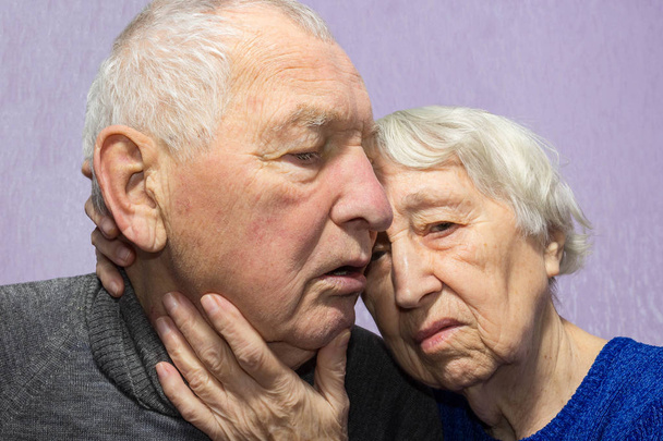 Portrait of a sad elder couple at home - Fotó, kép
