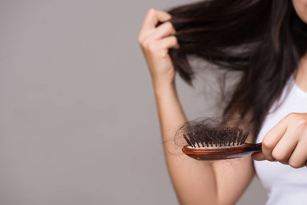 Healthy concept. Woman show her brush with long loss hair and lo - Fotoğraf, Görsel