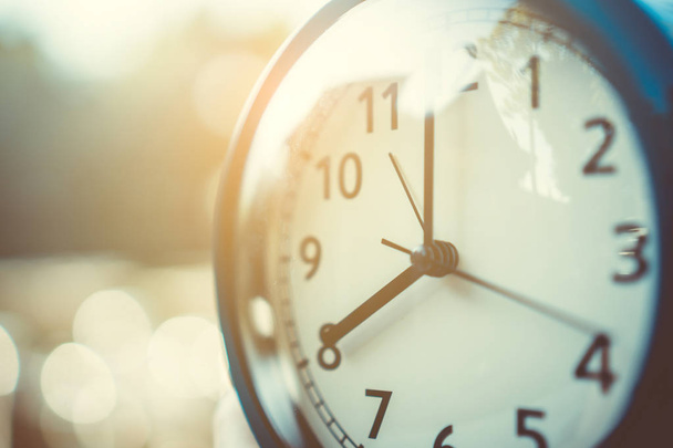 Selective focus of alarm clock with nature background. - Photo, Image
