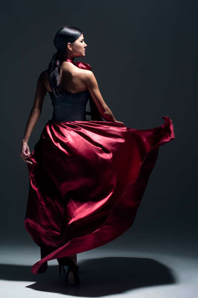 Young sexy dancing woman in red dress - Φωτογραφία, εικόνα
